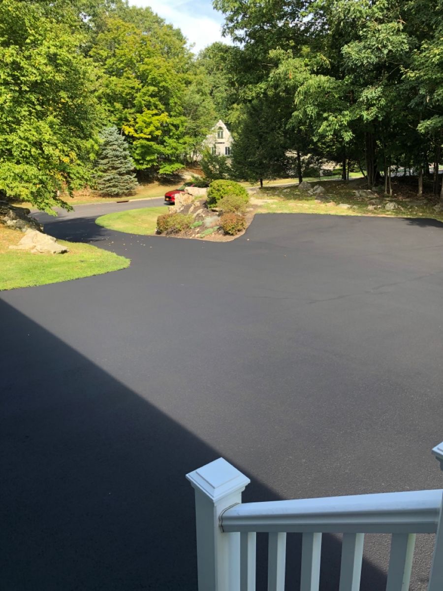 Beautiful driveway in Amesbury with fresh sealcoating